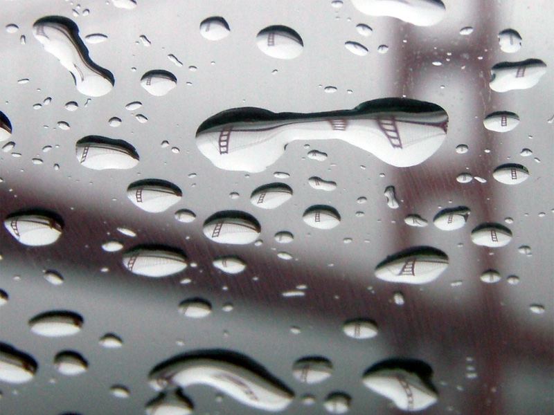 Golden Gate Bridgee refracted in raindrops.
